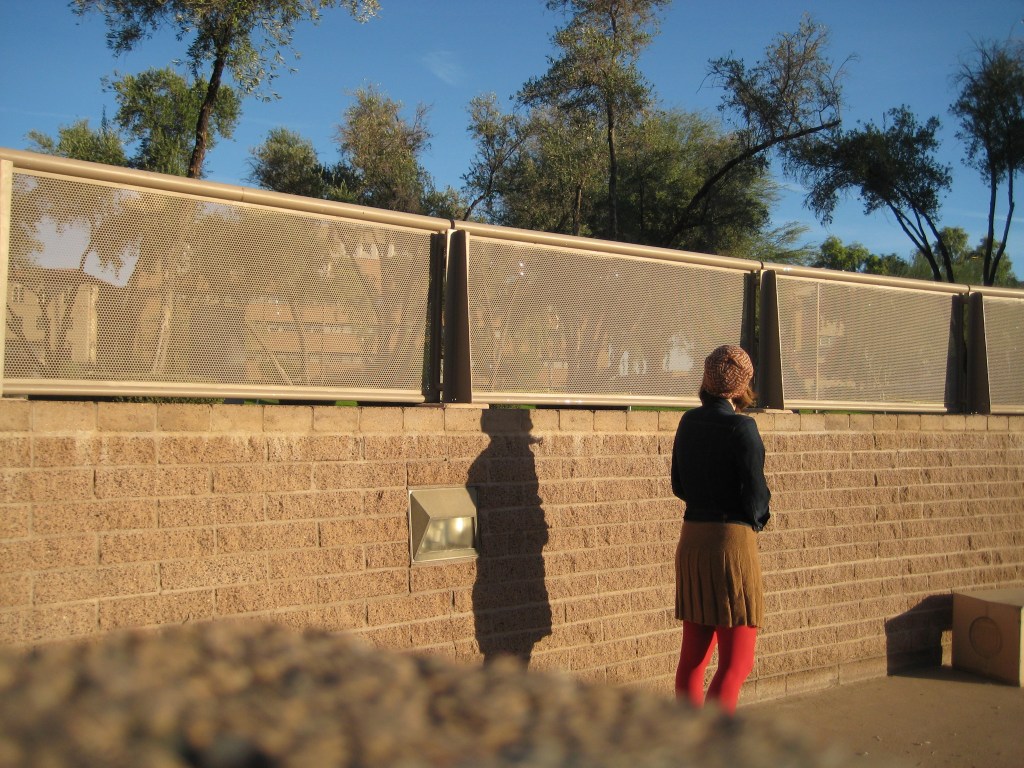 Vega Young woman in a park wearing a handknitted hat