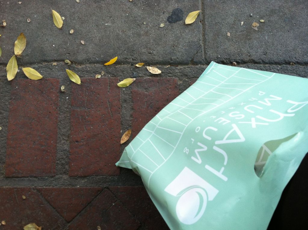 PhxArt bag on brick sidewalk
