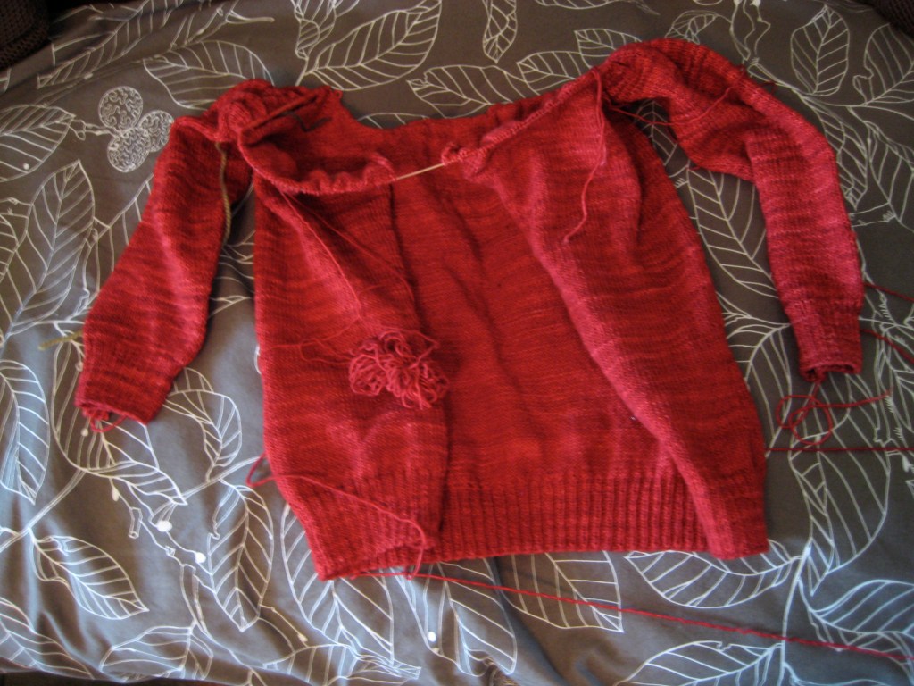 Partially knitted red cardigan 
