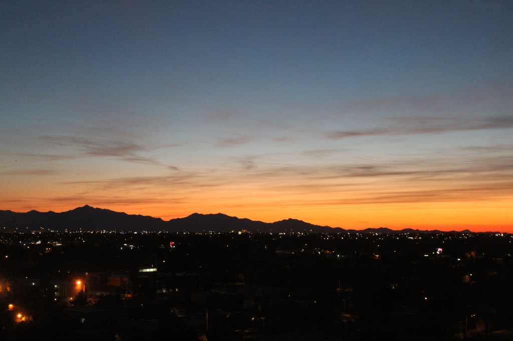 Orange sunset over mountains in Phoenix, AZ