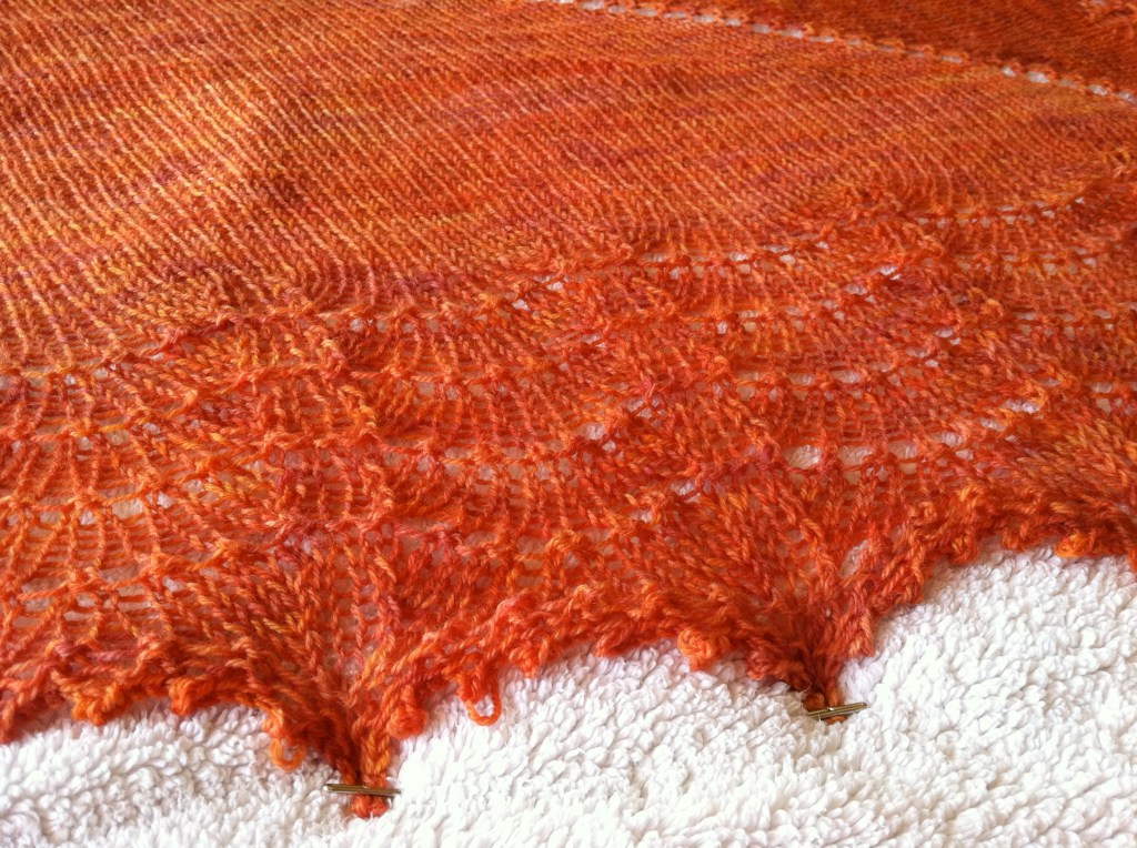 Coral-colored lace shawl