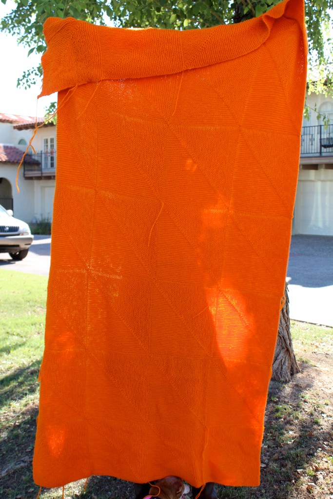 Large orange knitted blanket