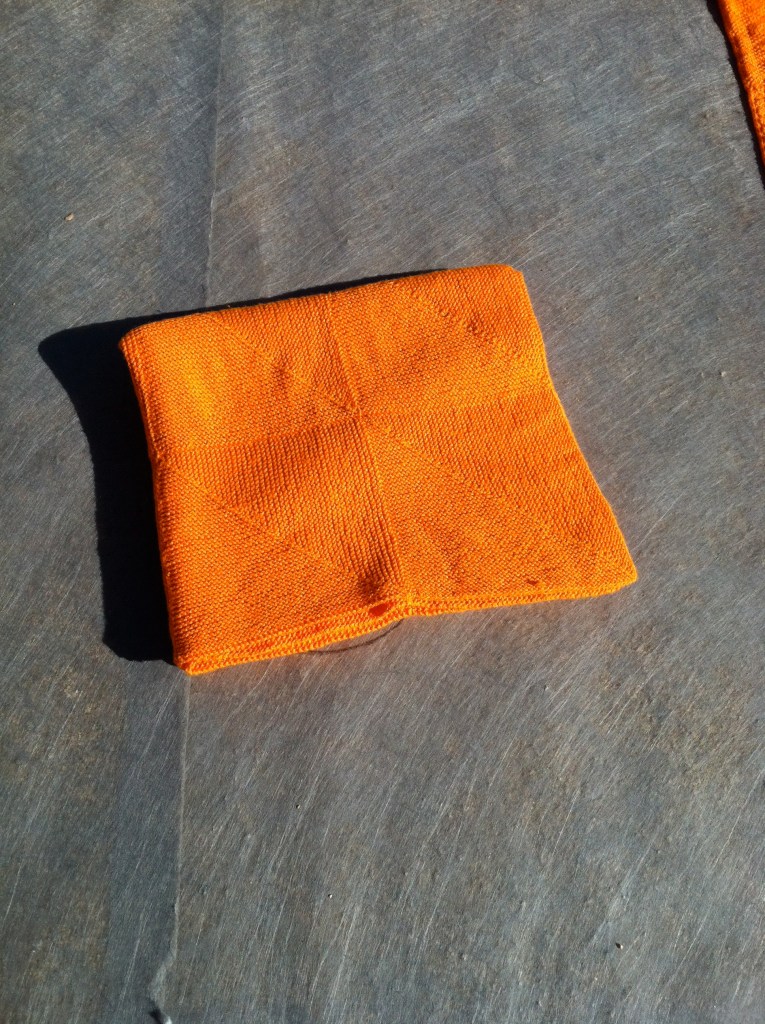 Folded orange blanket