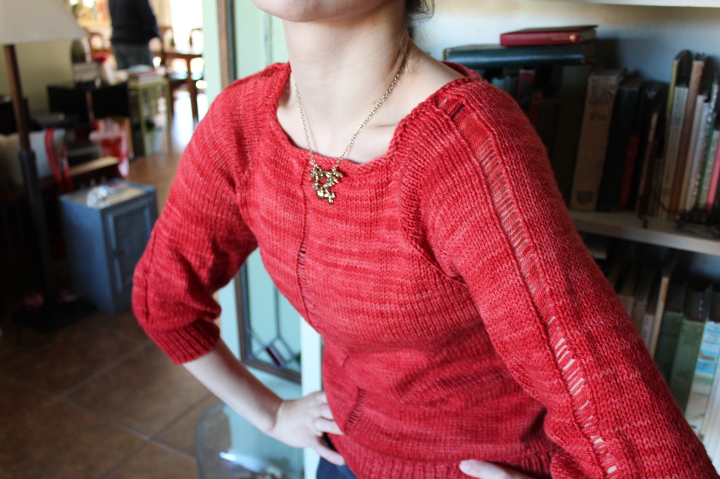 Woman modeling a red sweater