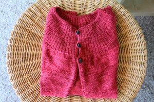 Red cardigan with black buttons