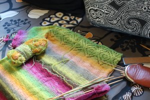 Brightly colored knitted top in progress