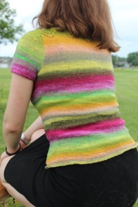 Woman wearing a brightly striped sweater top