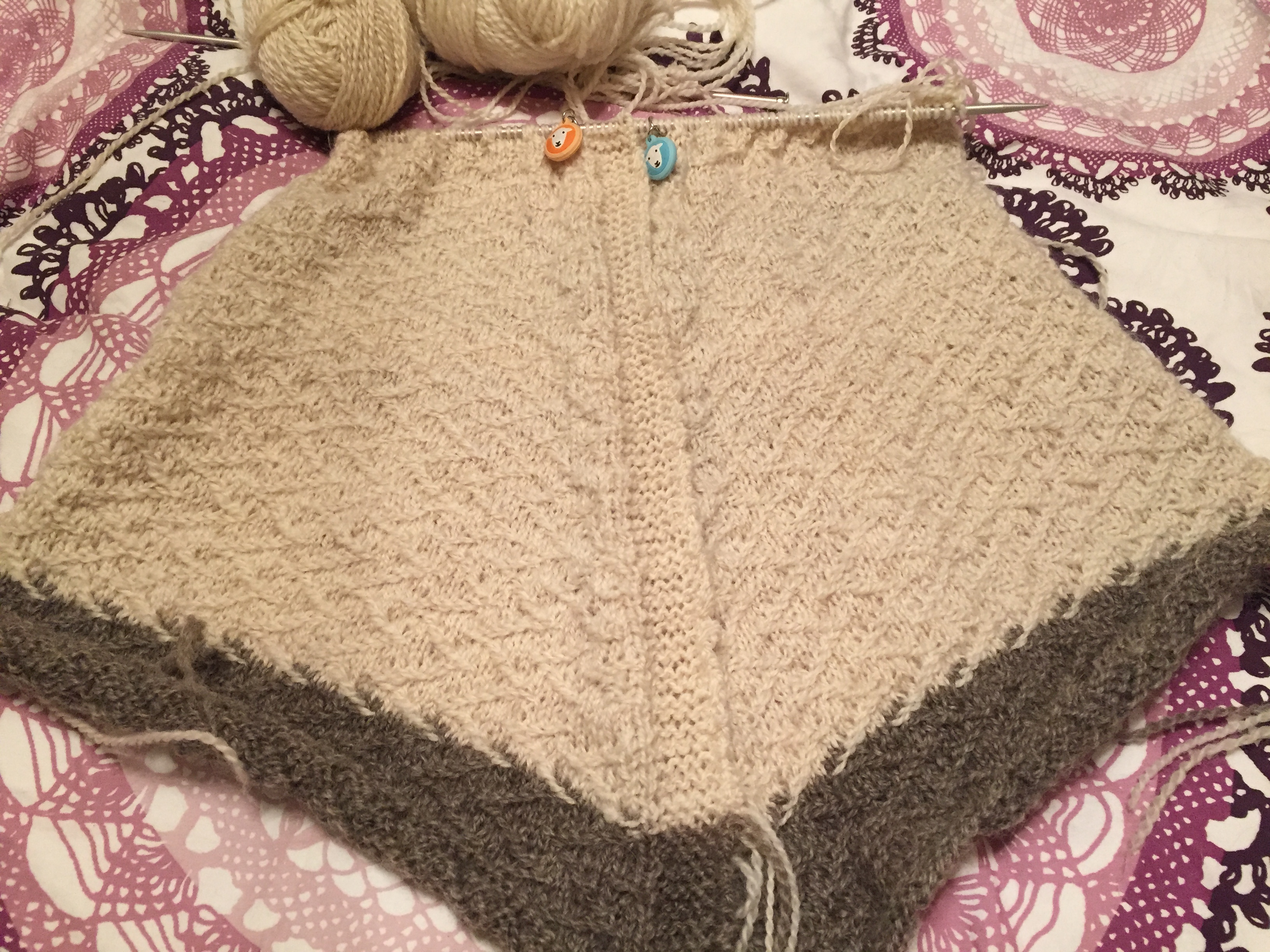 Two sweater fronts in progress, knitted at the same time