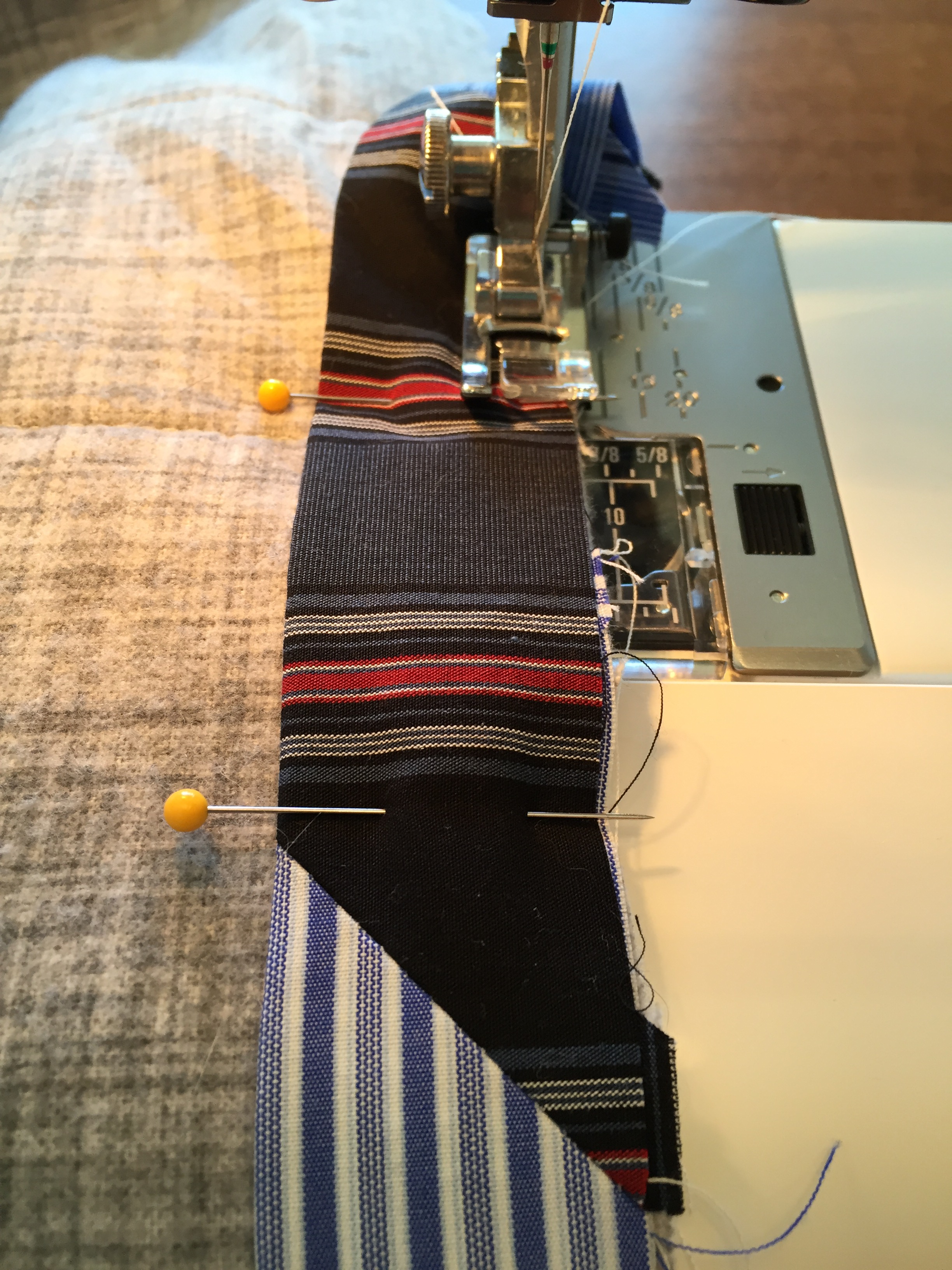 Patchwork bias binding ready to be sewn onto a quilt