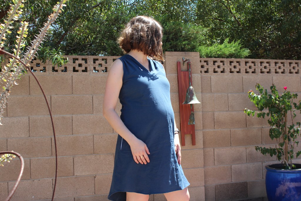 Pregnant woman wearing a blue Endless Summer Tunic