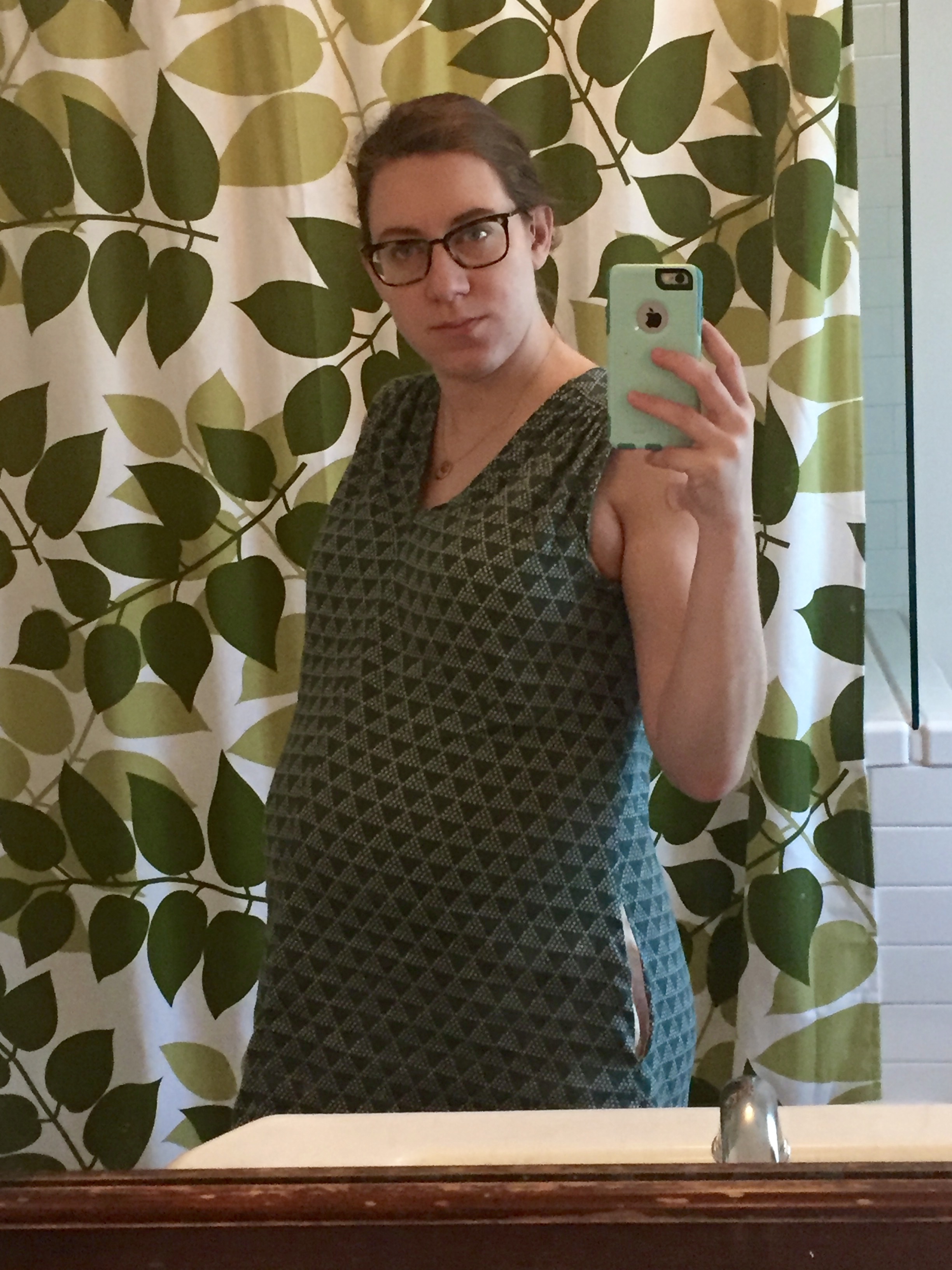 Woman wearing a green printed Endless Summer tunic