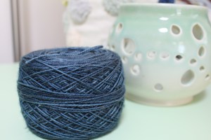 Cake of sparkly blue yarn dyed by Gherkin's Bucket