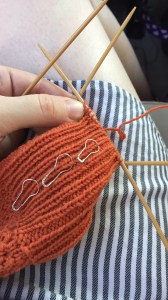 Leg of a Rick and Roll sock by Hands Occupied in orange Quince and Co Finch yarn