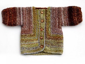 Image of a Baby Surprise Jacket knitted out of handspun yarn, image copyright Adrian Bizilia