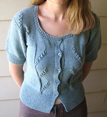 Image of a woman wearing the Pea Pod Cardigan by Mel Clark, image copyright Mel Clark